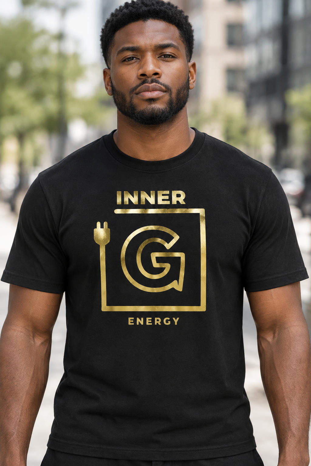 Black male model wearing black shirt with gold lettering